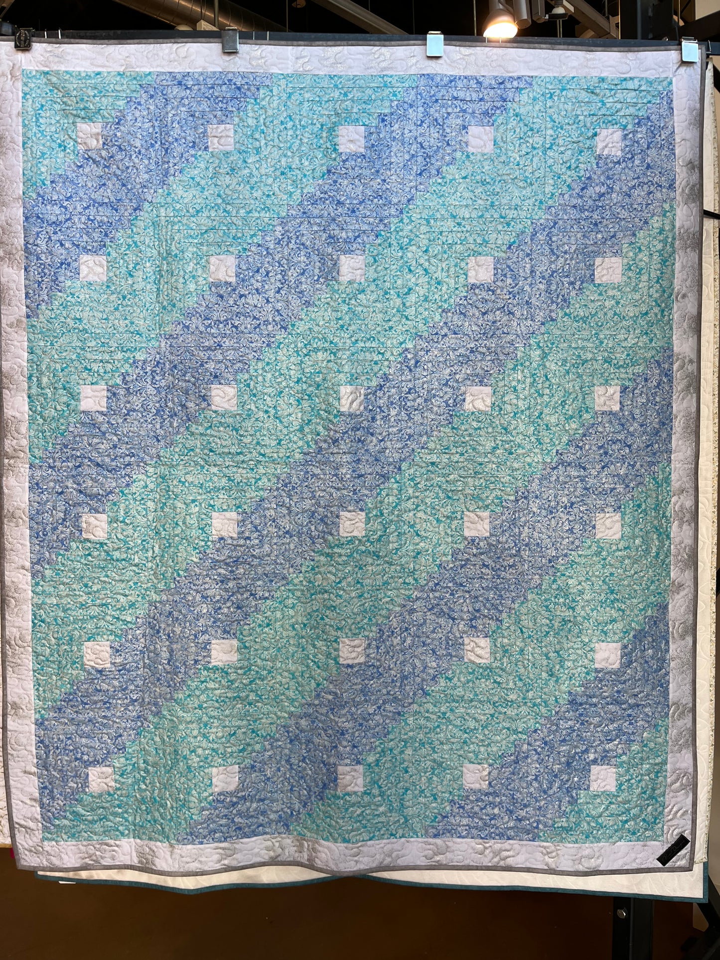 Log cabin style metallic aqua hues