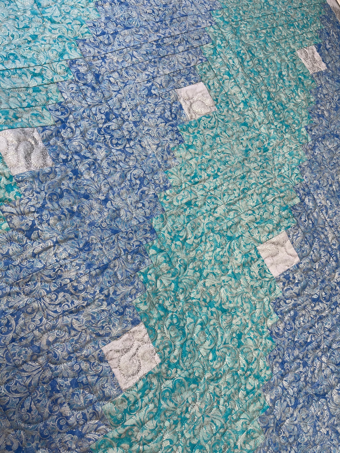 Log cabin style metallic aqua hues